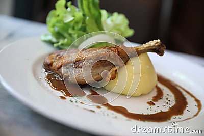 Confit de canard on a plate , Duck confit with vegetable Stock Photo