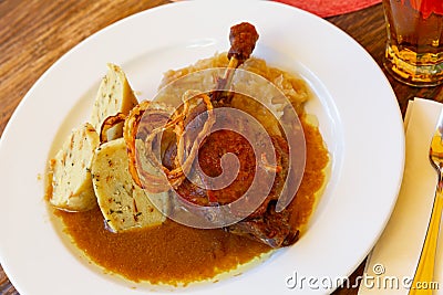 Confit du canard in czech with sauerkraut and potato dumplings Stock Photo