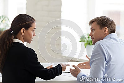 Conflict of female boss and male office worker Stock Photo