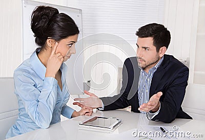 Conflict and problems on workplace: discussing boss and trainee. Stock Photo