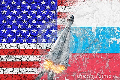 Confrontation between the USA and Russia. Threat of nuclear strike. The flags of two countries painted on the concrete wall. Stock Photo