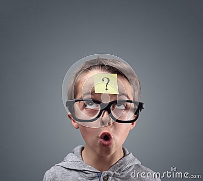 Confused boy thinking with question mark Stock Photo