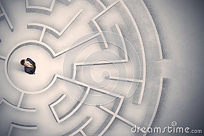 Business man trapped in a circular maze Stock Photo