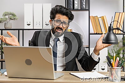 Confused businessman embarrassed about ambiguous question, having doubts, no answer idea, clueless Stock Photo