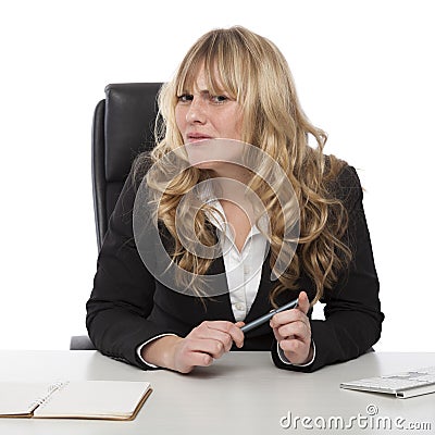 Confused businesswoman with a puzzled frown Stock Photo