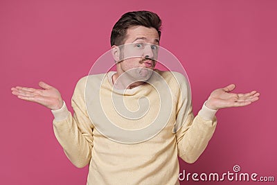 Confused caucasian man is unsure having no idea what to do next Stock Photo