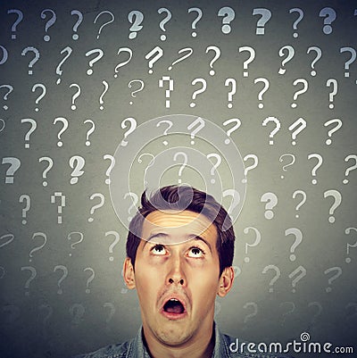 Confused curious shocked man has many questions and no answer Stock Photo