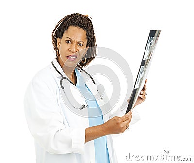 Confused Doctor With X-Ray Results Stock Photo