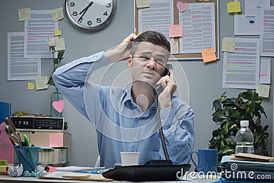 Confused employee on the phone Stock Photo