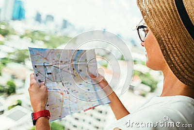 Confused female with destination map Stock Photo