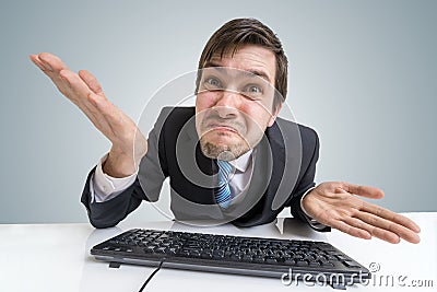 Confused frustrated and unsure man is working with computer Stock Photo