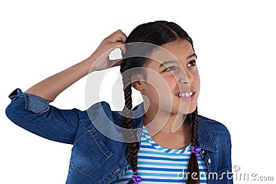 Confused girl standing against white background Stock Photo