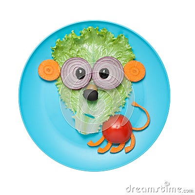 Confused lion made of vegetables on plate Stock Photo