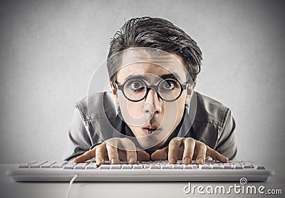 Confused man typing on the keyboard Stock Photo