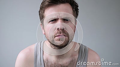 Confused mature caucasian guy frowning looking at camera. Stock Photo