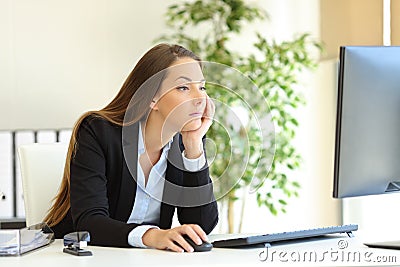Confused office worker checking computer content Stock Photo
