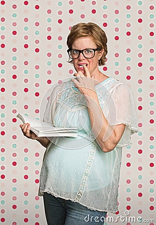 Confused Pregnant Woman Reading Stock Photo