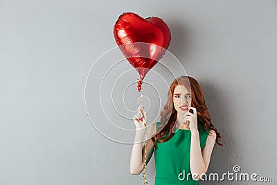 Confused redhead emotional young woman Stock Photo