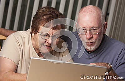 Confused Senior Adult Couple Having Fun on the Computer Stock Photo