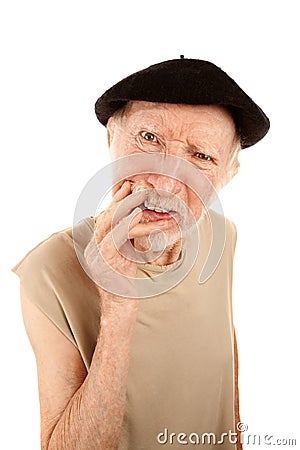 Confused senior man in beret Stock Photo