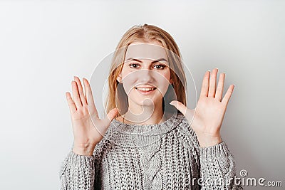 Confused shy clueless woman with open arms Stock Photo