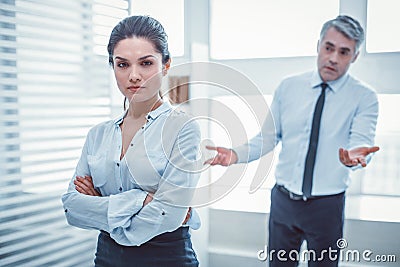 Confused superior asking his employee about situation Stock Photo