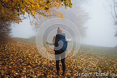 Confused tourist does not know which way to go. Lost hiker in fog Stock Photo