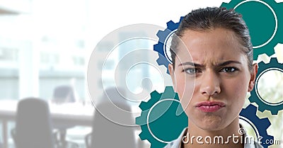 Confused woman in an office with blue cogs Stock Photo
