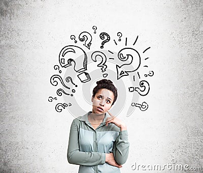 Confused woman with questions Stock Photo