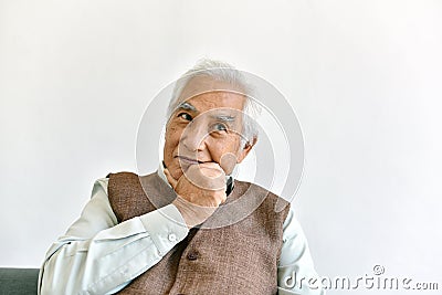 Confusing and forgetful elderly asian man with thinking gesture, Alzheimer`s disease. Stock Photo