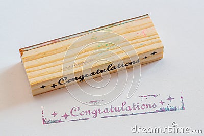 Congratulation stamped on paper Stock Photo