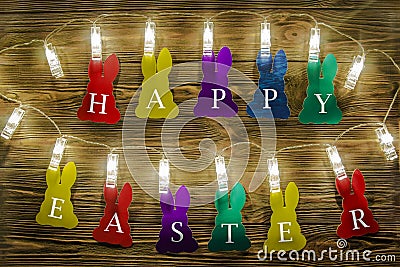 Congratulations on Easter. Color silhouettes of rabbits with written letters of white color Stock Photo