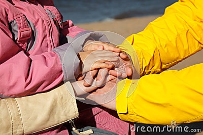 Connected hands of family as support sign Stock Photo