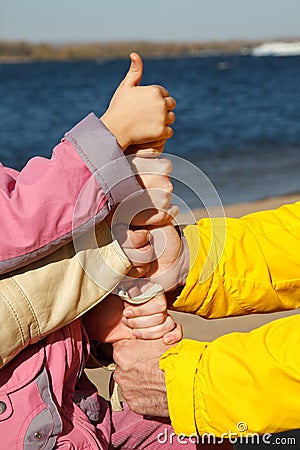 Connected hands of family as symbol of unity Stock Photo
