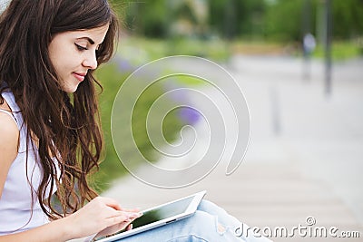 Connected. Hipster woman using digital tablet computer. Stock Photo