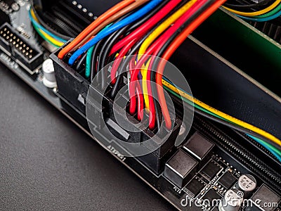 Connecting power to the computer`s motherboard, power supply, 24+8, power supply to the desktop computer processor, close-up, sel Stock Photo