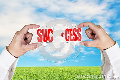 Connecting two puzzles for success Stock Photo