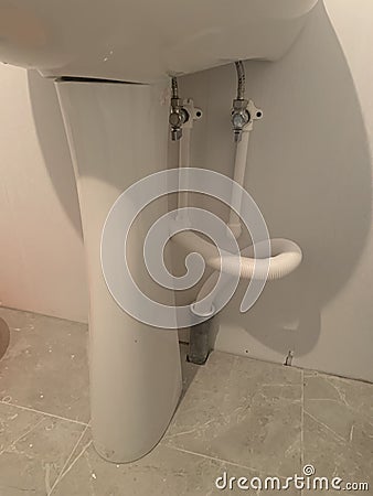 connection of water pipes to the washbasin Stock Photo