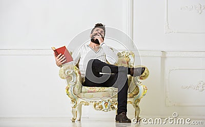 Connoisseur of literature concept. Macho spends leisure with book. Connoisseur, on thoughtful face enjoy literature Stock Photo