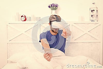 Conscious awakening. Return to reality. Man explore vr while relaxing in bed. Awakening from virtual reality. VR Stock Photo