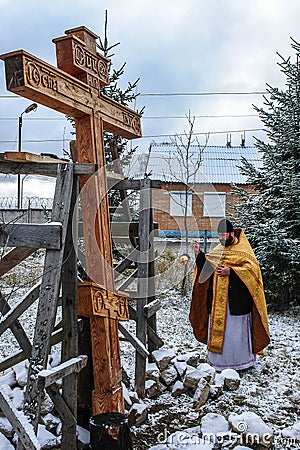 The consecration of the memorial Orthodox cross near the temple in the Kaluga region of Russia. Editorial Stock Photo