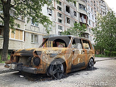 Consequences of the war in Ukraine, destroyed houses and burned cars Editorial Stock Photo