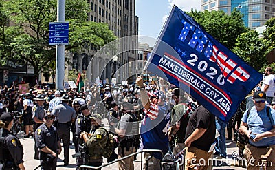 Conservative Demonstrator Holds Up a Trump 2020 Flag that Reads Make Liberals Cry Again Editorial Stock Photo