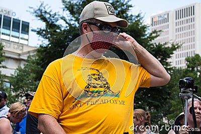 Conservative Demonstrator Wears a Gadsden Flag Shirt at a Rally Editorial Stock Photo