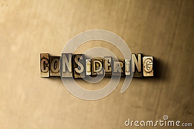 CONSIDERING - close-up of grungy vintage typeset word on metal backdrop Cartoon Illustration