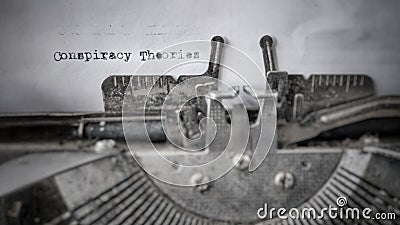 Conspiracy Theories text typed on blank paper with typewriter in vintage background Stock Photo