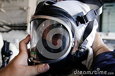 Romanian man using a firefighter mask Editorial Stock Photo