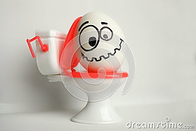 Constipation is a comical concept. an egg Stock Photo
