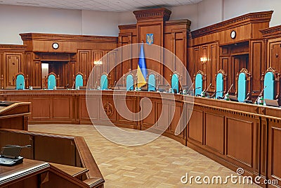Constitutional Court of Ukraine law. Emblem of Ukraine trident logo. Empty courtroom trial court of law justice symbol Editorial Stock Photo