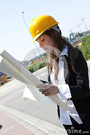 Construcion worker analyzing blueprints Stock Photo